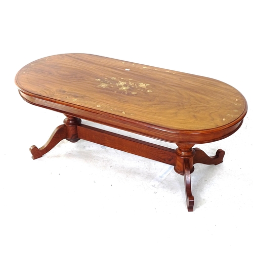 2061 - A modern Indian hardwood oval coffee table, with brass and copper floral inlay, L121cm, H45cm, D56cm