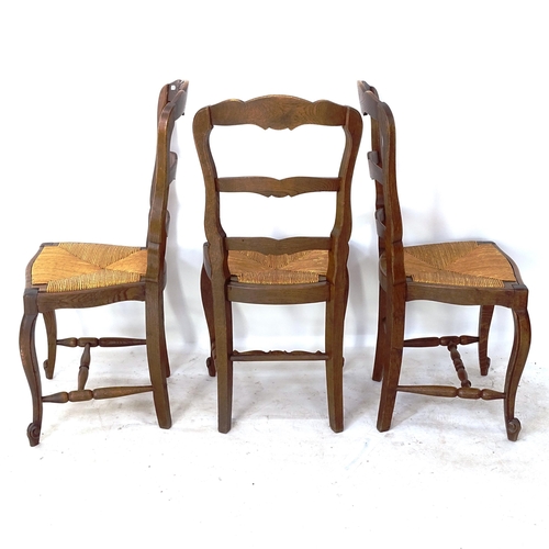 2063 - A set of 6 French carved oak ladder-back rush-seated dining chairs