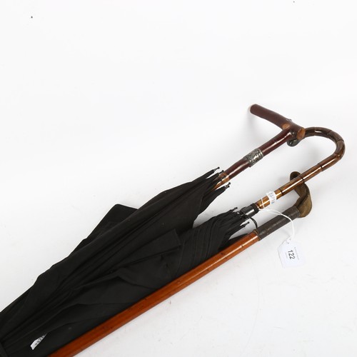 122 - 2 Vintage silver-mounted umbrellas, and a steel-mounted riding crop (3)