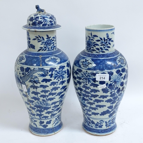 214 - A pair of Chinese blue and white 'Dragon' jars, height 37cm, and 1 lid (both chipped and cracked)