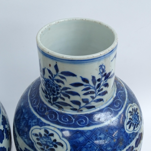 214 - A pair of Chinese blue and white 'Dragon' jars, height 37cm, and 1 lid (both chipped and cracked)