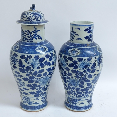 214 - A pair of Chinese blue and white 'Dragon' jars, height 37cm, and 1 lid (both chipped and cracked)