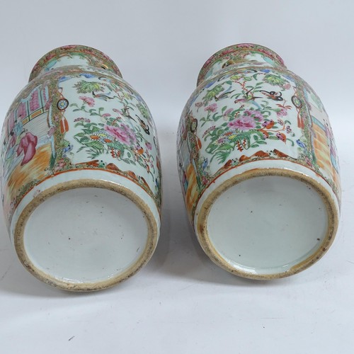 213 - A pair of Chinese Canton famille rose vases, with enamelled courtyard decoration, with applied gilde... 