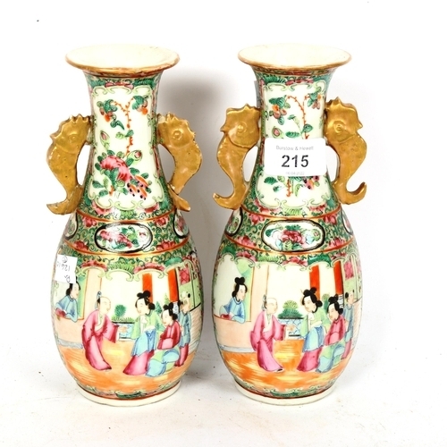 215 - A pair of Chinese Canton famille rose vases, hand painted and enamelled courtyard and bird decoratio... 