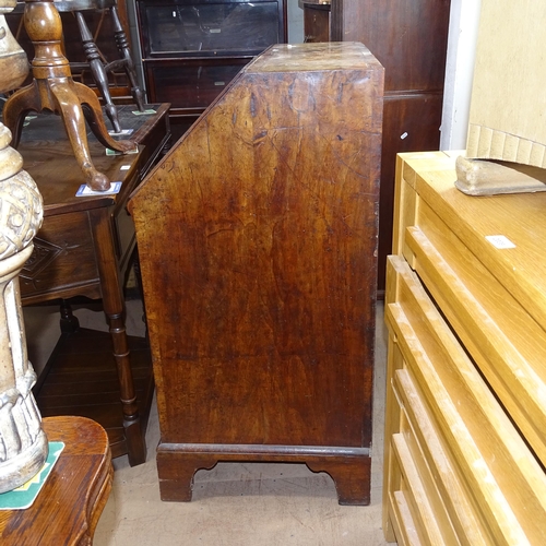 2004 - A Georgian mahogany and burr-walnut veneered bureau, the fall-front revealing a fitted interior, wit... 