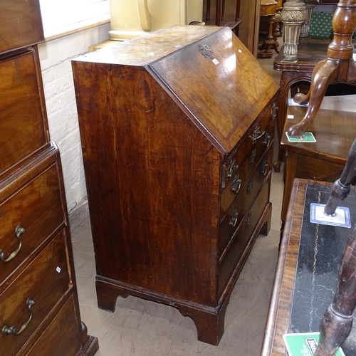 2004 - A Georgian mahogany and burr-walnut veneered bureau, the fall-front revealing a fitted interior, wit... 