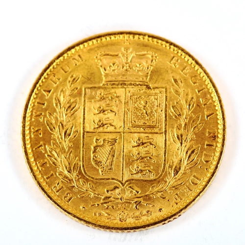 135 - A Victoria 1864 gold full sovereign coin, die no. 27, 7.9g