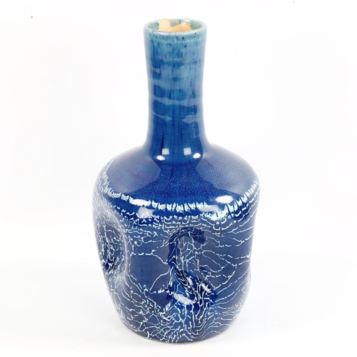 1003 - An art pottery dimple vase by Christopher Dresser for Linthorpe, makers stamp to base, height 23cm