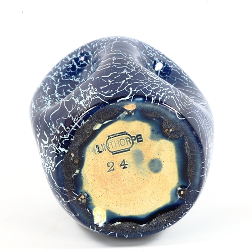 1003 - An art pottery dimple vase by Christopher Dresser for Linthorpe, makers stamp to base, height 23cm