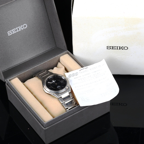 23 - SEIKO - a titanium Solar quartz bracelet watch, ref. V145-0BA0, black dial with halfly Roman numeral... 