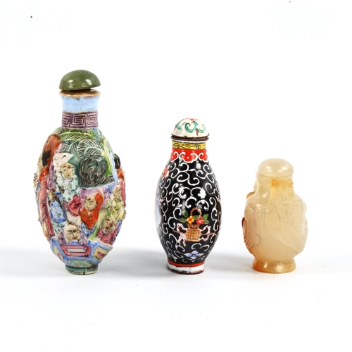 1017 - 3 Chinese snuff bottles, comprising a relief carved jade bottle with stopper, height 4.5cm, a relief... 