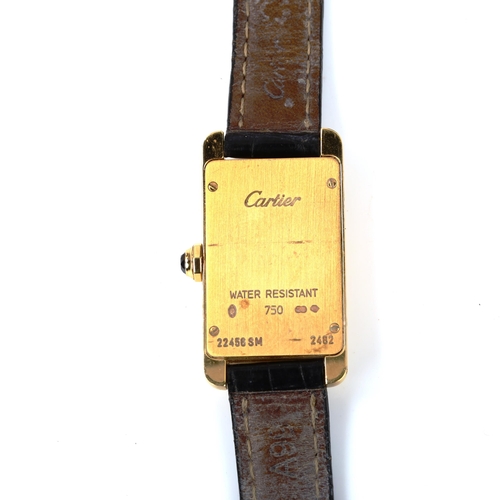 28 - CARTIER - a lady's 18ct gold Tank Americaine quartz wristwatch, ref. 2482, circa 2000, rectangular s... 