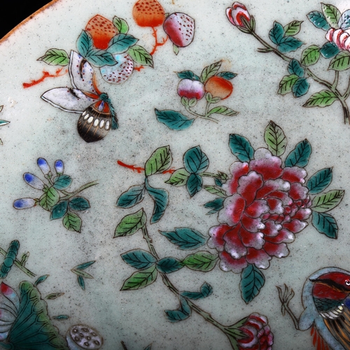 1038 - A Chinese celadon glaze porcelain plate, with painted butterflies and birds, diameter 25cm