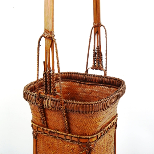 1040 - A finely woven Japanese ikebana flower basket, height 52cm