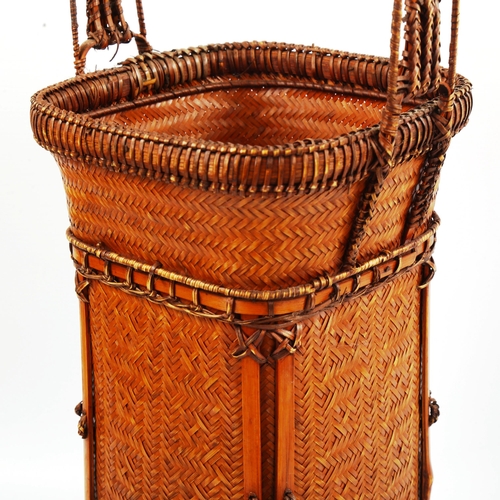 1040 - A finely woven Japanese ikebana flower basket, height 52cm