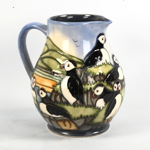 1045 - MOORCROFT POTTERY - a Puffin design jug, 1997, height 14.5cm, boxed
