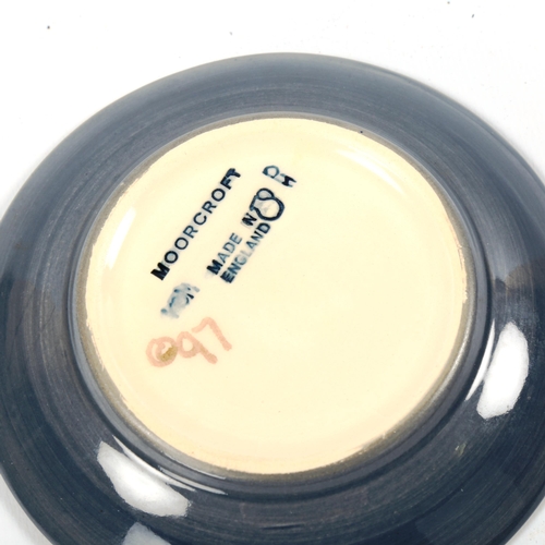 1046 - MOORCROFT POTTERY - a Puffin design dish, 1997, diameter 12cm