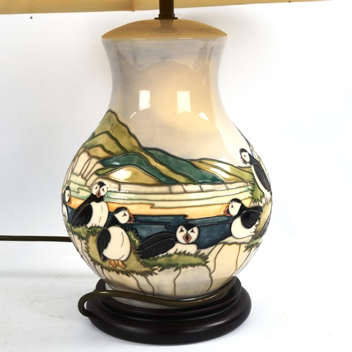 1047 - MOORCROFT POTTERY - a Puffin pattern table lamp and shade, height including shade 58cm