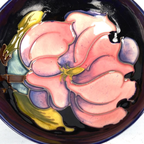 1048 - MOORCROFT POTTERY - a Magnolia design bowl, diameter 14cm, and 2 other small Moorcroft Potter pin di... 