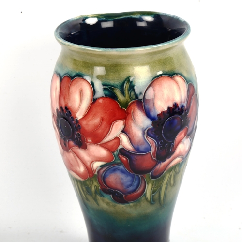 1049 - MOORCROFT POTTERY - a Poppy design vase, painted signature, height 20cm