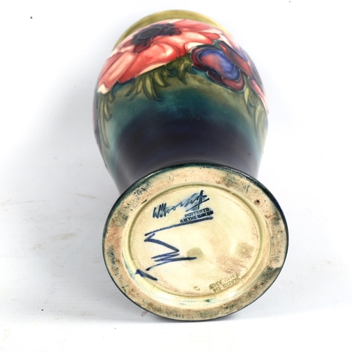 1049 - MOORCROFT POTTERY - a Poppy design vase, painted signature, height 20cm