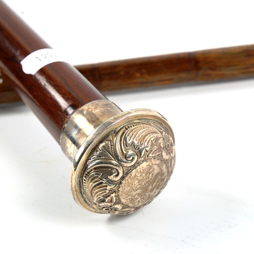 1054 - 2 hallmarked silver-topped walking canes