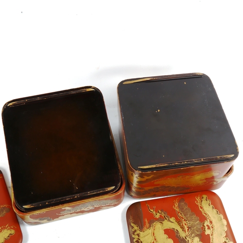 1061 - A pair of Japanese gilded red lacquer square 2-section boxes and covers, with heron designs, 21cm ac... 
