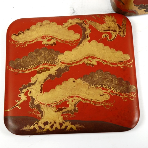 1061 - A pair of Japanese gilded red lacquer square 2-section boxes and covers, with heron designs, 21cm ac... 