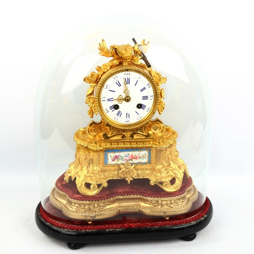 63 - A 19th century French ormolu and porcelain 8-day mantel clock, by Samuel Marti, white enamel dial wi... 