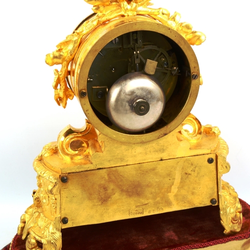 63 - A 19th century French ormolu and porcelain 8-day mantel clock, by Samuel Marti, white enamel dial wi... 