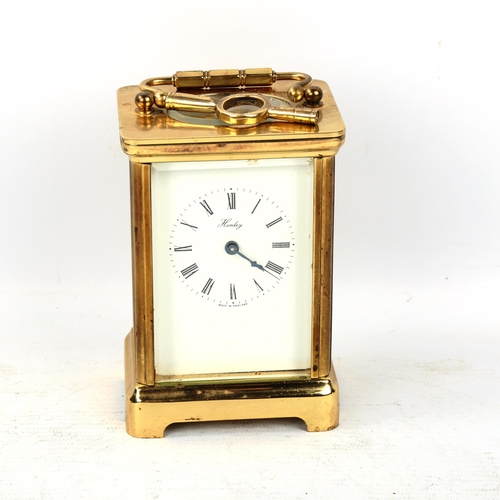 69 - A brass-cased carriage clock, by Henley, white enamel dial with Roman numeral hour markers and blued... 