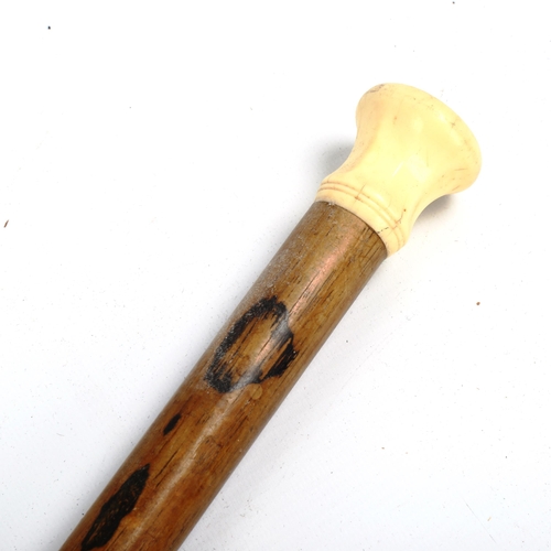 1070 - An 18th/19th century ivory-handled walking cane, with seal top