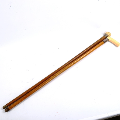 1071 - A Japanese ivory-handled netsuke, depicting man faces, and an ivory and silver-handled walking stick... 