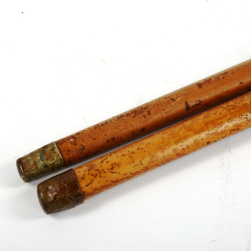 1071 - A Japanese ivory-handled netsuke, depicting man faces, and an ivory and silver-handled walking stick... 