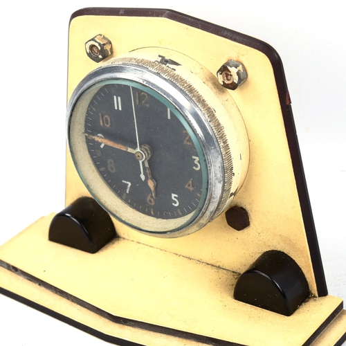 71 - A military issue tank dashboard clock, in Art Deco stepped case, ref. 6A/1002, Mk IIA, black dial wi... 