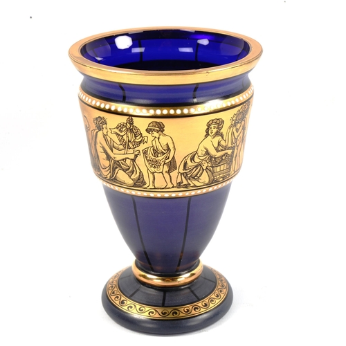 1082 - A Venetian dark blue glass vase with gilded Classical frieze, height 15cm, diameter 10cm