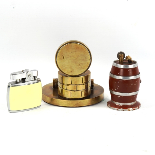 1092 - A brass match-striker stand, an Omega blue and red pocket lighter, and a souvenir barrel design tabl... 