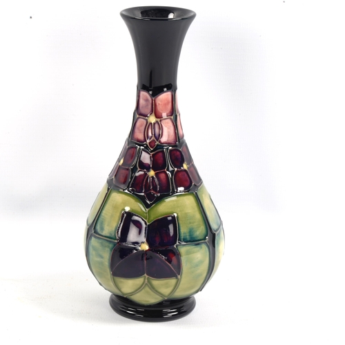 1102 - MOORCROFT POTTERY - a Violet design narrow-neck vase, height 16.5cm, boxed
