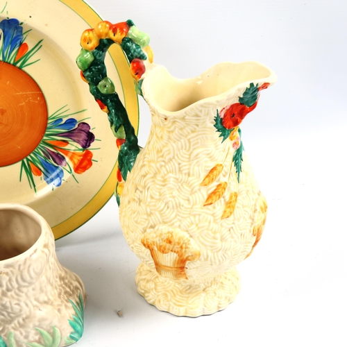 1108 - **WITHDRAWN** 4 pieces of Clarice Cliff pottery, comprising a Lovebirds design vase, height 21cm, a ... 