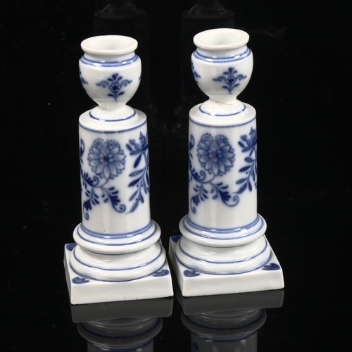 1113 - A pair of Meissen blue and white porcelain candlesticks, height 14cm