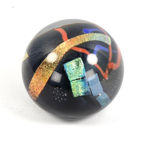 1116 - ROLLING KARG (American) - a coloured glass paperweight, signed, diameter 8cm