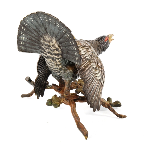 1299 - Cold painted bronze sculpture of a capercaillie on a branch, height 19cm