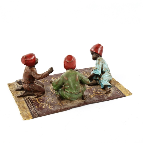 1300 - Austrian cold painted bronze sculpture, 2 Arab boys playing dice on a rug, 20cm x 14cm