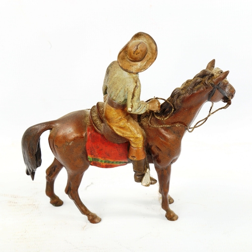 1305 - Austrian cold painted bronze cowboy on horseback, length 12cm, height 12cm