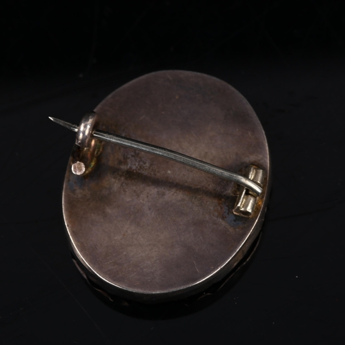 1361 - A miniature watercolour portrait a man wearing a powdered wig, in unmarked silver brooch mount, heig... 