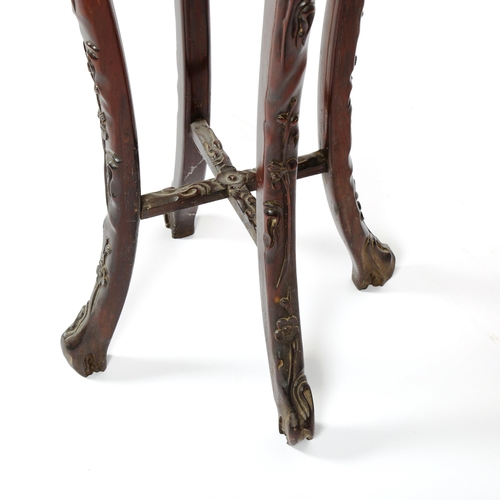 1016 - A Chinese rosewood jardiniere stand, late 19th century, with inset marble top and carved and pierced... 