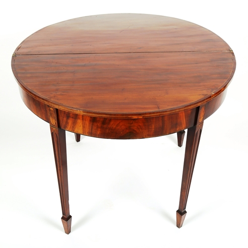 1073 - A George III mahogany demilune fold over tea table, width 91cm