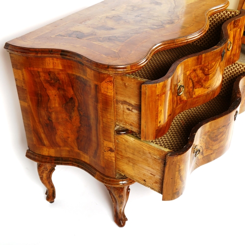 1077 - An 18th century French walnut serpentine-front 2-drawer commode, on cabriole legs, width 102cm, dept... 