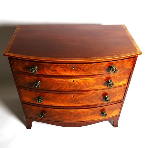 1078 - A Regency mahogany bow-front chest of 4 long graduated drawers, with rosewood crossbanding and origi... 