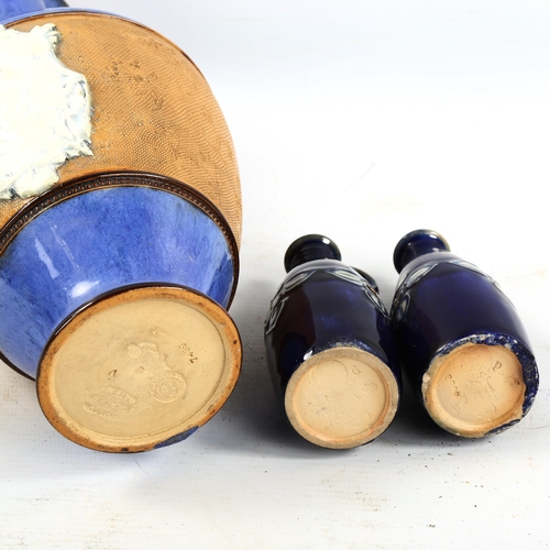 1377 - A Royal Doulton ewer with relief Jockey plaque and two Doulton bottles, tallest 29cm